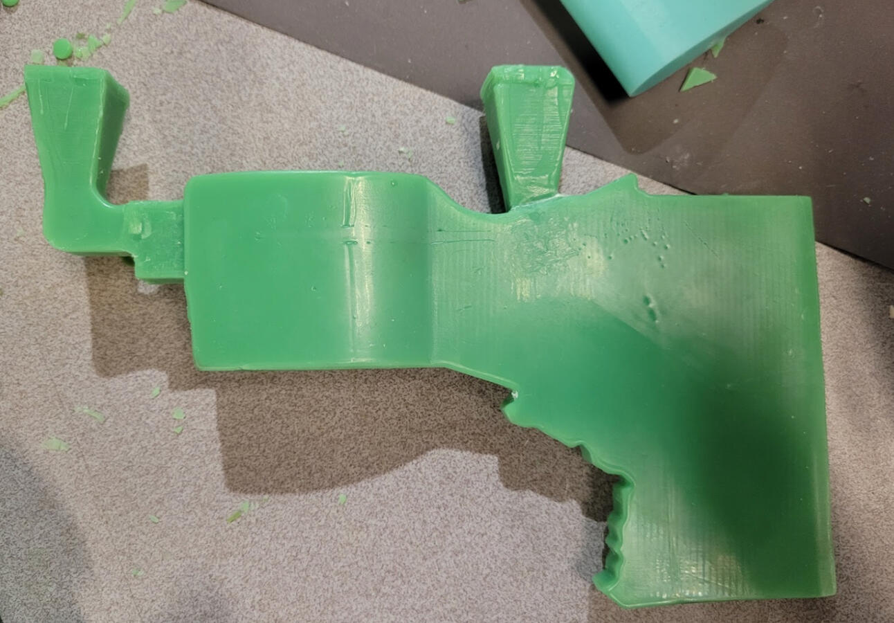 Wax cast of axe head with gates